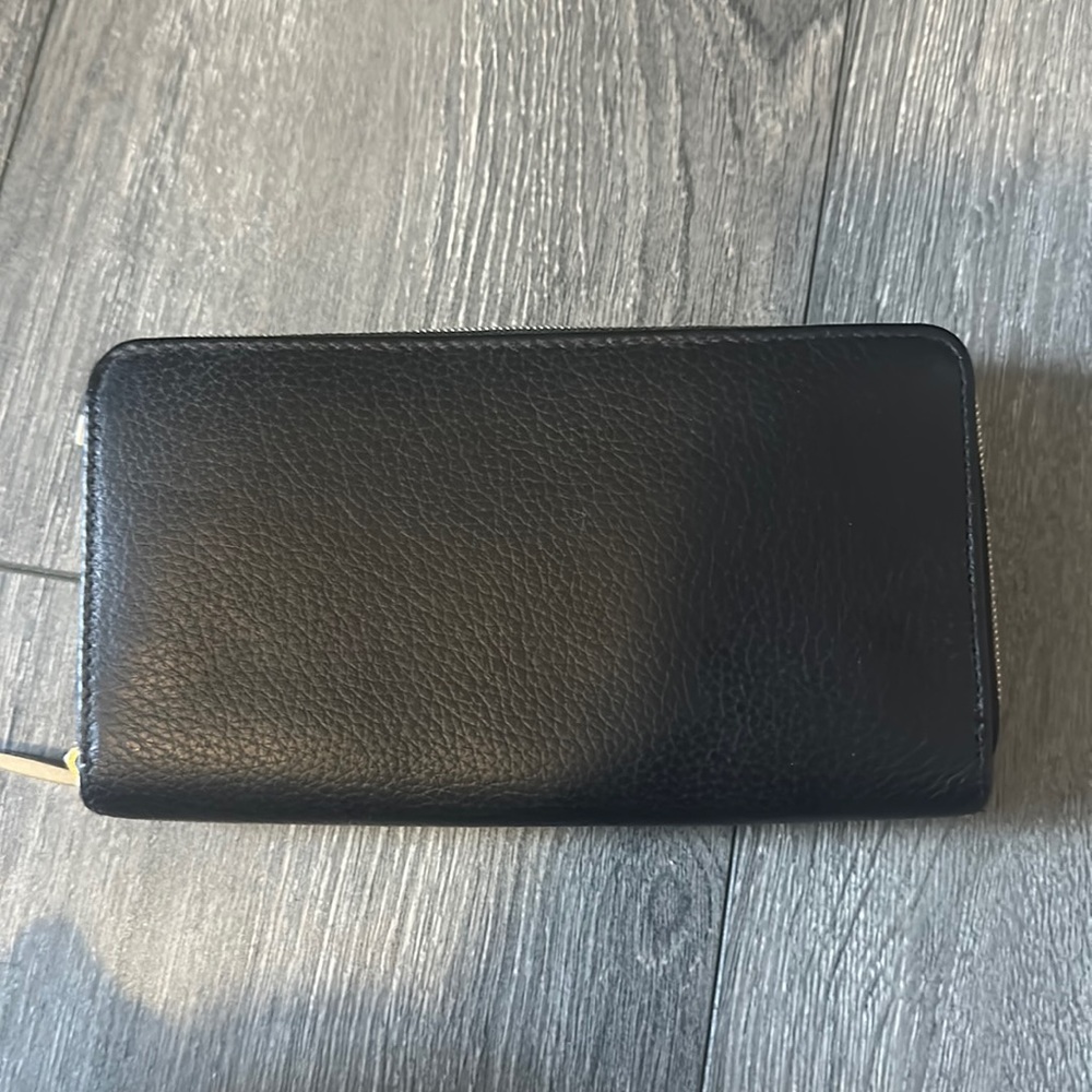 black leather wallet with card space and gold detailing
